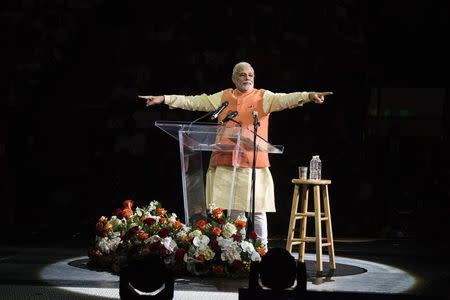 India's Prime Minister Narendra Modi gestures while speaking at Madison Square Garden in New York, during a visit to the United States, September 28, 2014. REUTERS/Lucas Jackson