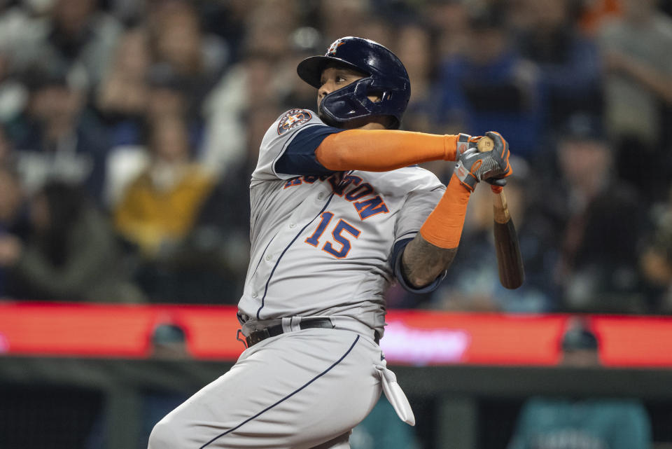 Houston Astros' Marten Maldonado hits an RBI-double off Seattle Mariners starting pitcher Luis Castillo during the second inning of a baseball game, Monday, Sept. 25, 2023, in Seattle. (AP Photo/Stephen Brashear)