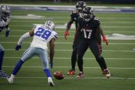 Dallas Cowboys cornerback C.J. Goodwin (29) follows on Cowboys onside kick as Atlanta Falcons' Olamide Zaccheaus (17) looks on in the second half of an NFL football game in Arlington, Texas, Sunday, Sept. 20, 2020. Goodwin recovered the kick. (AP Photo/Ron Jenkins)