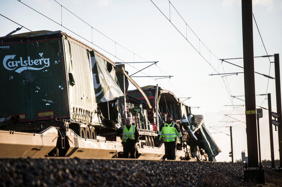 <em>Accident – it has not yet been confirmed how many people died after an accident involving a freight train and a passenger train on a bridge in Denmark (Picture: Reuters)</em>