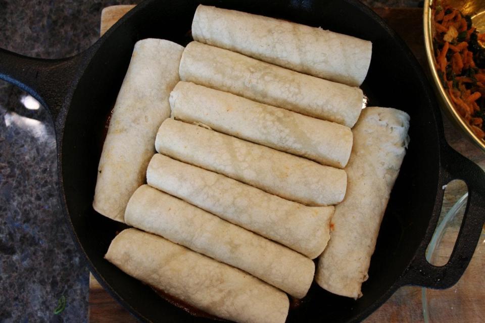 Place your enchiladas in a skillet pan and cook in the oven.