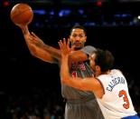 Dec 19, 2015; New York, NY, USA; Chicago Bulls guard Derrick Rose (1) looks to pass against New York Knicks guard Jose Calderon (3) during second half at Madison Square Garden. The New York Knicks defeated the Chicago Bulls 107-91. Mandatory Credit: Noah K. Murray-USA TODAY Sports