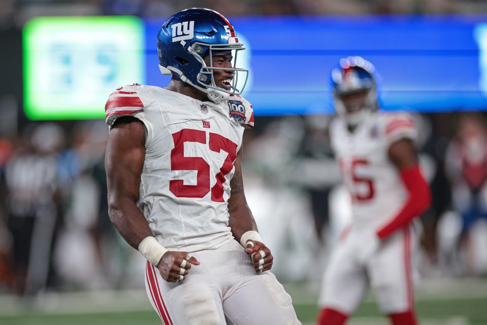 Aug 24, 2024; East Rutherford, New Jersey, USA; New York Giants linebacker K.J. Cloyd celebrates after a defensive stop against the New York Jets during the second half at MetLife Stadium. Mandatory Credit: Vincent Carchietta-USA TODAY Sports