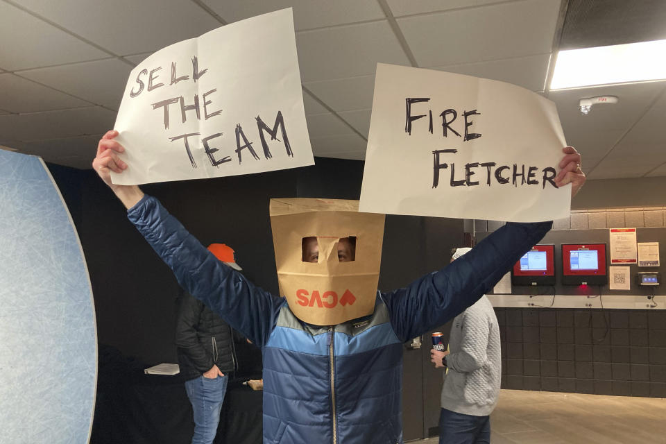 A fan poses for a photo before an NHL hockey game between the Philadelphia Flyers and the Detroit Red Wings, Sunday, March 5, 2023, in Philadelphia. (AP Photo/Dan Gelston)