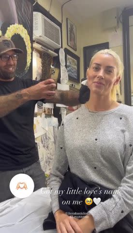 <p>Heather Rae El Moussa/instagram</p> Heather Rae El Moussa smiles for the camera after the tattoo is completed.