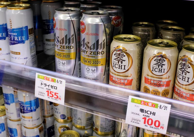 Various cans of alcohol-free beers are displayed on a supermarket shelf in Tokyo