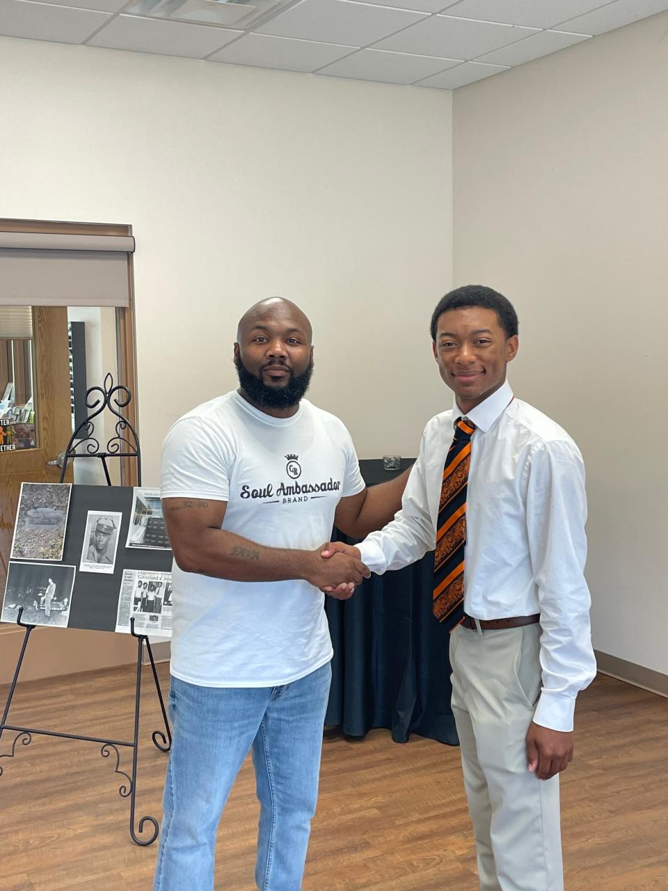 Leesburg High School senior Dencov Bryant being awarded with the Samuel Shepherd Memorial Civil Rights Scholarship by the Robinson House Foundation.
