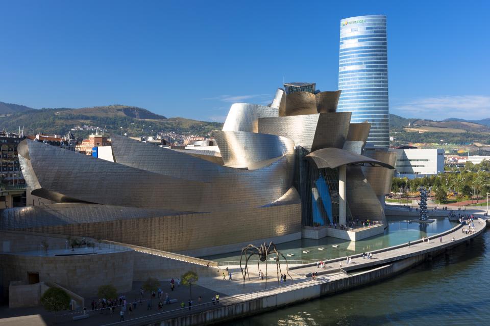 SPAIN - SEPTEMBER 22: Frank Gehry's Guggenheim Museum, The Spider sculpture, Iberdrola Tower and River Nervion at Bilbao, Spain (Photo by Tim Graham/Getty Images)