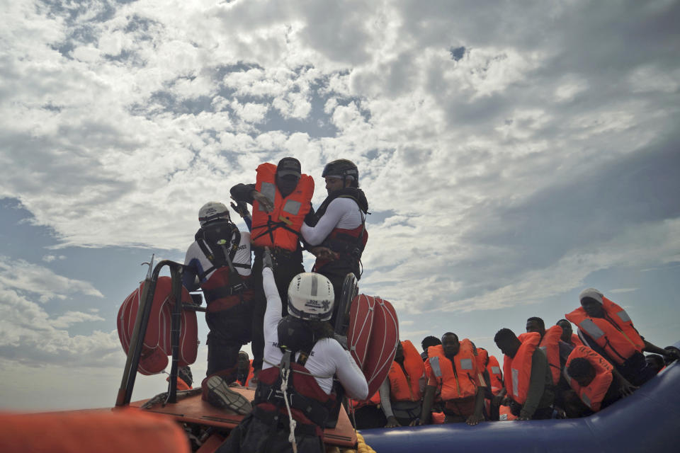 A person is transferred onto a rescue boat some 14 nautical miles from the coast of Libya in Mediterranean Sea, Sunday, Sept. 8, 2019. Humanitarian groups SOS Mediterranee and Doctors Without Borders have successfully rescued 50 migrants and brought them aboard the Ocean Viking. (AP Photo/Renata Brito)