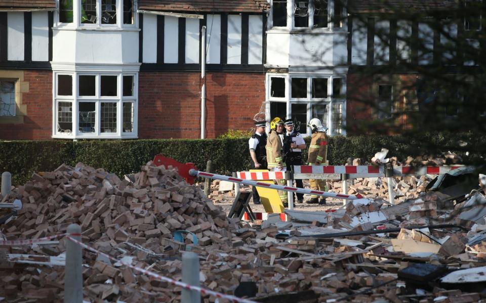 Several buildings collapsed after the blast - Credit: PA