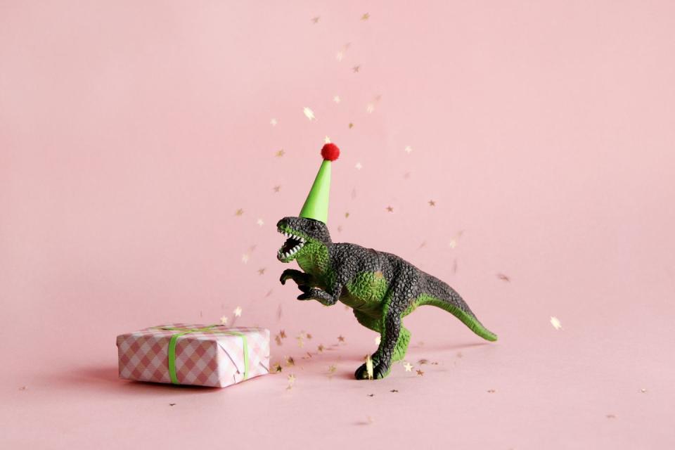 toy dinosaur with birthday gift