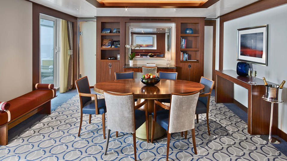 The dining room of the Ovation's Grand Winter Garden Suite—fruit basket and Champagne included.