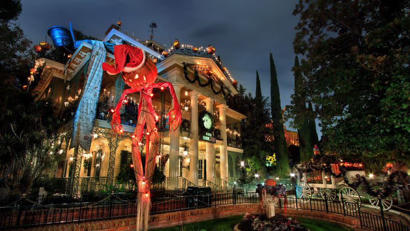 Disneyland’s “Haunted Mansion” attraction gets a “Nightmare Before Christmas” makeover for the Halloween season.