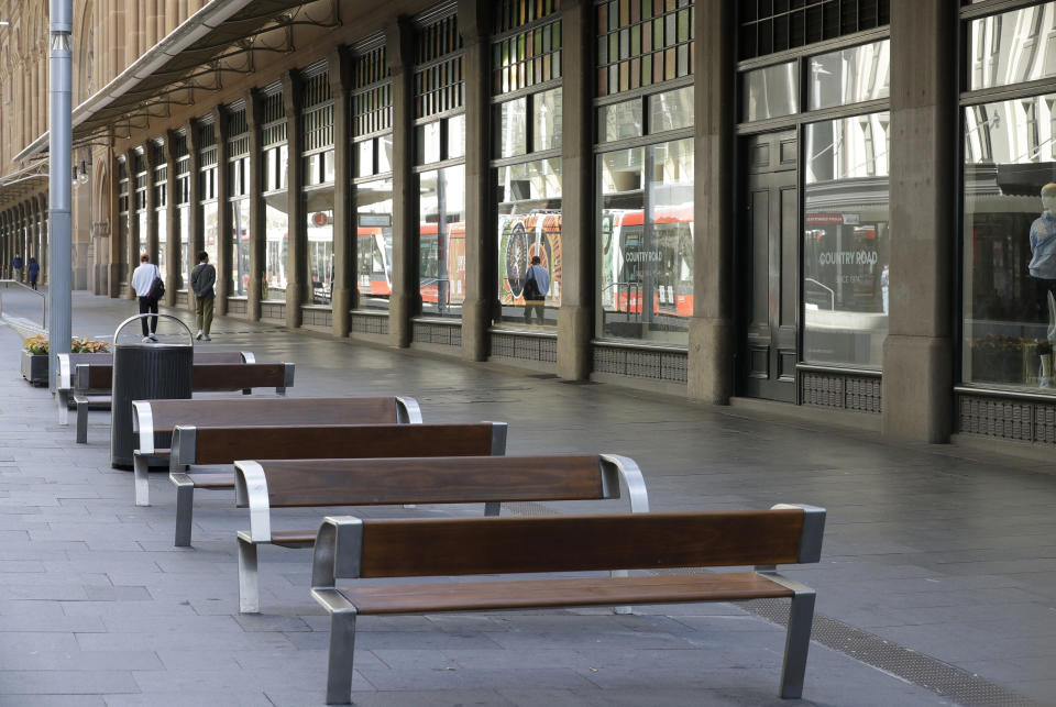 A normally busy shopping area in Sydney is nearly empty of people, Wednesday, July 7, 2021. Sydney's two-week lockdown has been extended for another week due to the vulnerability of an Australia population largely unvaccinated against COVID-19, officials said. (AP Photo/Rick Rycroft)