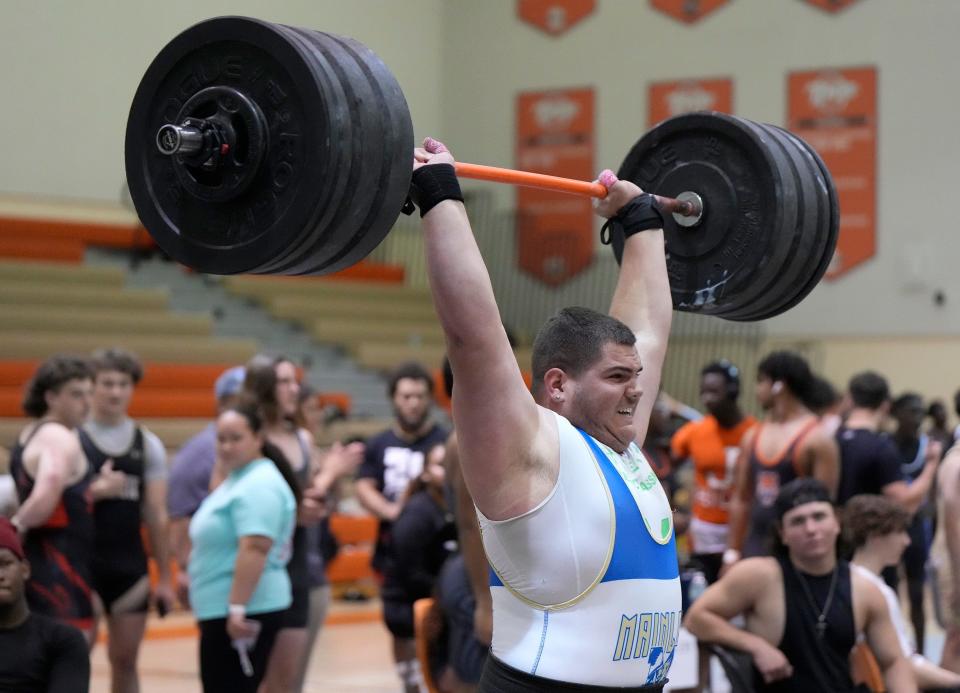 Mainland's Elijah Walker competes in the district weightlifting meet at University High School in Orange City, Wednesday, March 27, 2024.