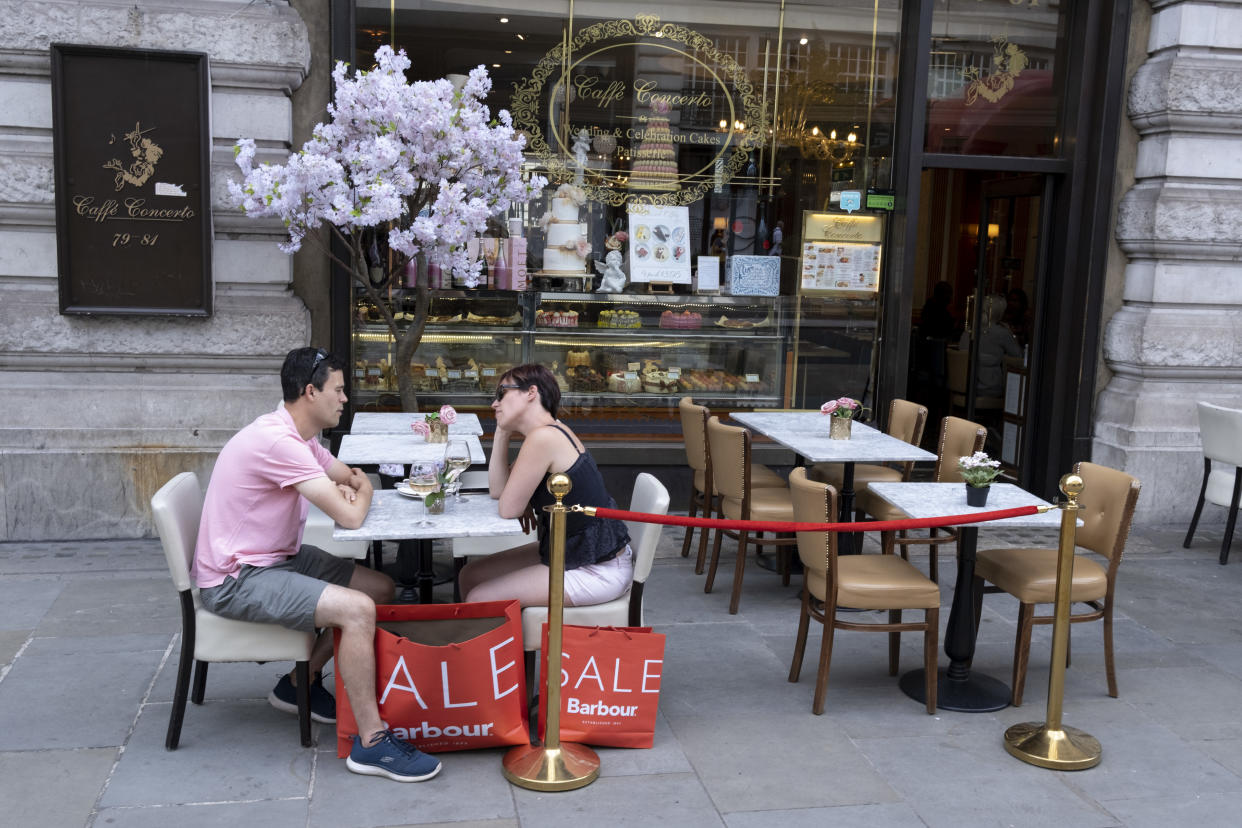A shopping couple enjoy cool drinks at Caffe Concerto on Regent Street, on Covid 'Freedom Day', on 19 July, in London, England. Photo: Richard Baker/In Pictures via Getty Images