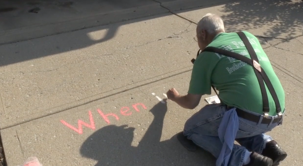 Joe Spangler, 66, has been writing the Declaration of Independence on his driveway every Fourth of July for a decade. (Photo: Indianapolis Star)