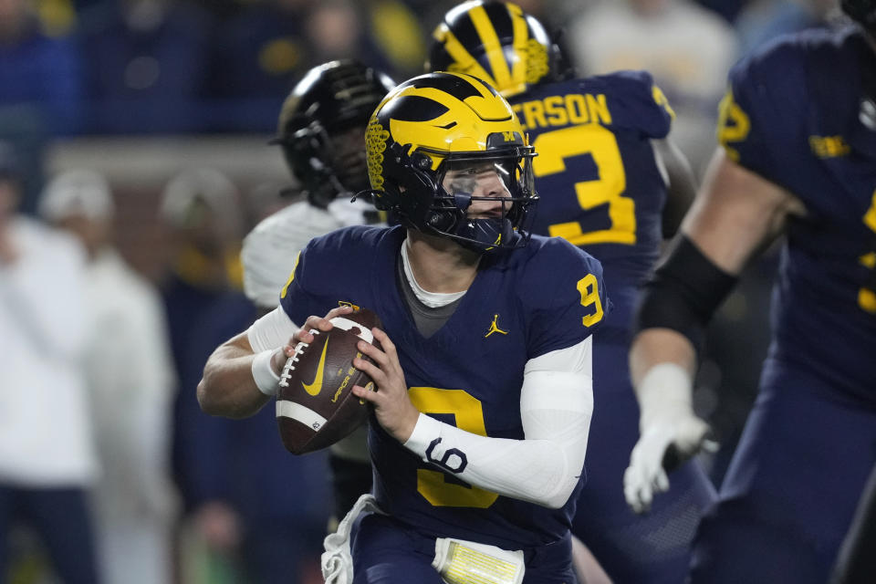 Michigan quarterback J.J. McCarthy (9) throws against Purdue in the first half of an NCAA college football game in Ann Arbor, Mich., Saturday, Nov. 4, 2023. (AP Photo/Paul Sancya)