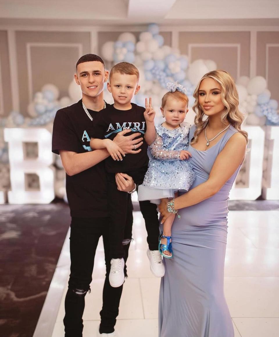 Phil Foden and pregnant Rebecca Cooke posed with their two children (Sophie Eleanor Photography)