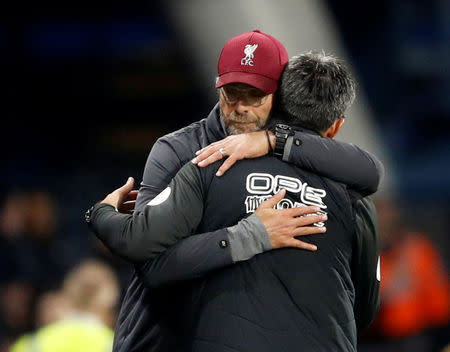 Soccer Football - Premier League - Huddersfield Town v Liverpool - John Smith's Stadium, Huddersfield, Britain - October 20, 2018 Liverpool manager Juergen Klopp embraces Huddersfield Town manager David Wagner at the end of the match Action Images via Reuters/Carl Recine