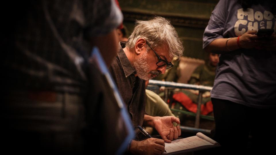 Sanjay Leela Bhansali in a behind the scenes shot from Netflix's "Heeramandi: The Diamond Bazaar."