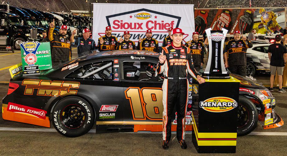 Sammy Smith poses with his ARCA Menards East Series title trophy