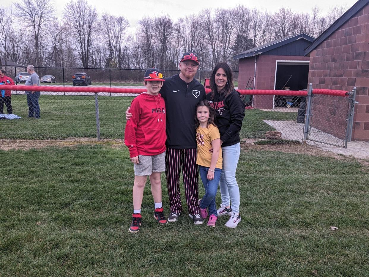 Field baseball coach Joe Peterson and his family after picking up his 200th career win.