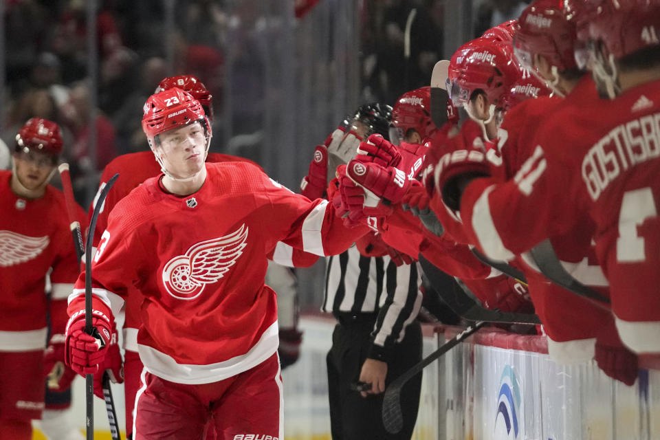 Detroit Red Wings left wing Lucas Raymond (23) celebrates his goal against the Columbus Blue Jackets in the first period of an NHL hockey game Saturday, Nov. 11, 2023, in Detroit. (AP Photo/Paul Sancya)