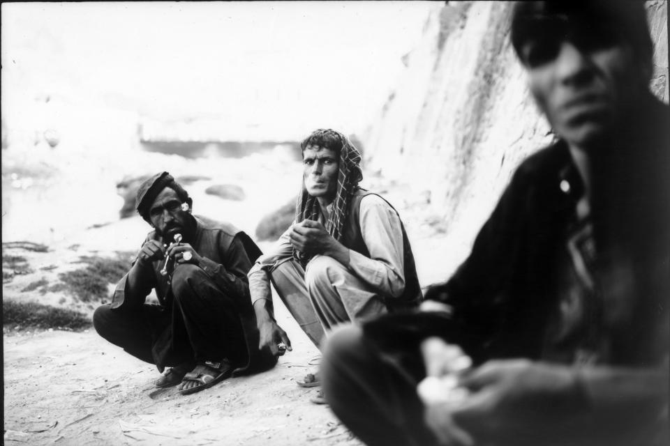 Addicts take doses of heroin under a bridge in Kabul, Afghanistan, Tuesday, June 20, 2023. (AP Photo/Rodrigo Abd)