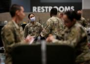 U.S. Army soldiers work to set up an intensive care unit at a military field hospital for non-coronavirus patients inside CenturyLink Field Event Center during the coronavirus disease (COVID-19) outbreak in Seattle