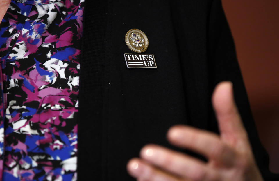 FILE - Rep. Lois Frankel, D-Fla., wears a "Times Up," pin as she speaks during an enrollment ceremony with House Speaker Paul Ryan of Wis., and Rep. Susan Brooks, R-Ind., for the, "Protecting Young Victims from Sexual Abuse and Safe Sport Authorization Act," on Capitol Hill, Tuesday, Feb. 6, 2018, in Washington. A 2021 survey by the global advocacy group, World Players, found 13% of 297 athletes surveyed across the globe had reported experiencing sexual abuse at least once as a child in sports. (AP Photo/Alex Brandon, File)