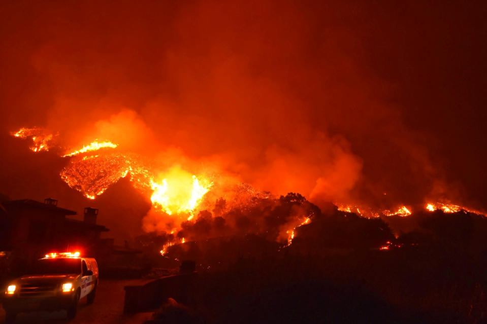 Thomas wildfire burns above Bella Vista Drive near Romero Canyon in this social media photo by Santa Barbara County Fire Department in Montecito, California, U.S. December 12, 2017.  Courtesy Mike Eliason/Santa Barbara County Fire Department/Handout via REUTERS  ATTENTION EDITORS - THIS IMAGE HAS BEEN SUPPLIED BY A THIRD PARTY.     TPX IMAGES OF THE DAY