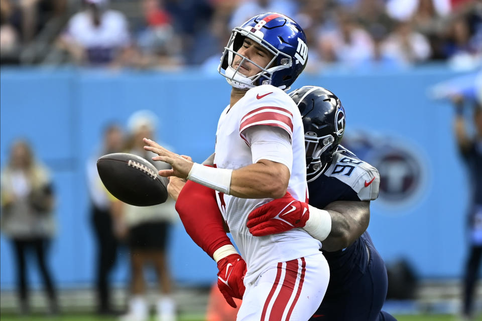 Tennessee Titans defensive tackle Jeffery Simmons (98) forces New York Giants quarterback Daniel Jones (8) to fumble during the first half of an NFL football game Sunday, Sept. 11, 2022, in Nashville. (AP Photo/Mark Zaleski)