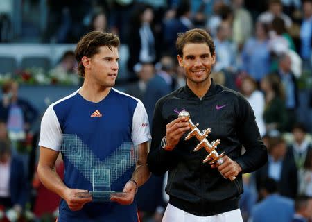 Tennis - ATP 1000 Masters - Madrid Open - Men's Singles Final - Dominic Thiem of Austria v Rafael Nadal of Spain - Madrid, Spain - 14/5/17 - Nadal and Thiem pose with their trophies at the end of the match. REUTERS/Susana Vera