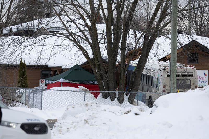 A Laval city bus is seen crashed into a daycare in Laval, Quebec