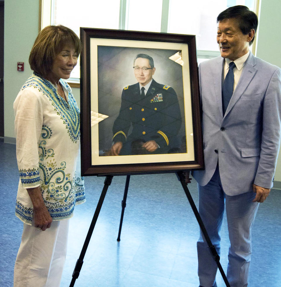 Dyanne McMath, niece of Col. Young-Oak Kim, and Woo Sung Han, award-winning journalist and author of “Unsung Hero” stand next to a portrait of the late Col. Young-Oak Kim after its unveiling at the Armed Forces Reserve Center at Camp Humphreys, South Ko (Barney Low / Alamy file)