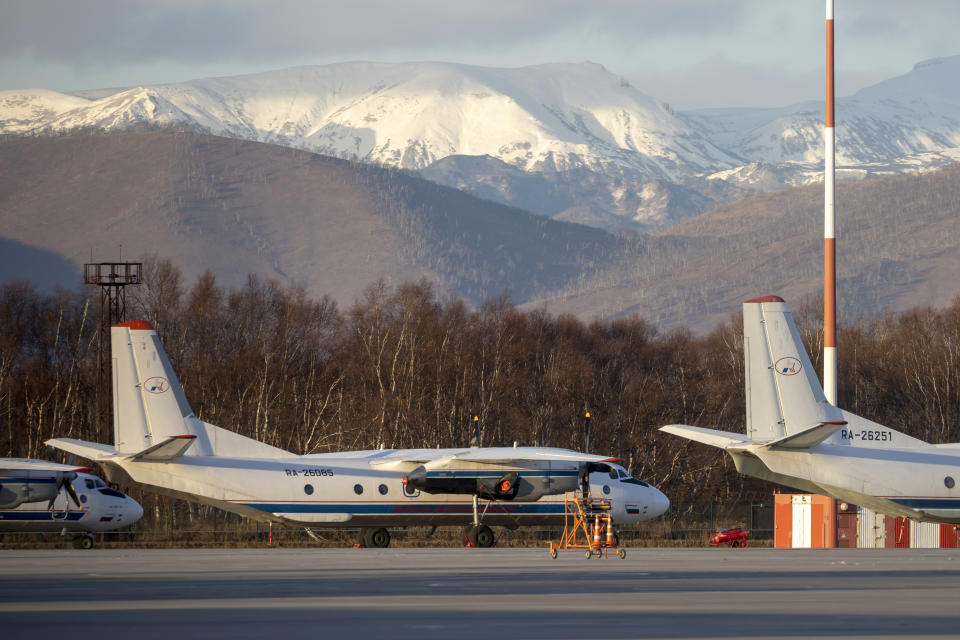 The Antonov An-26 with the same board number #RA-26085 as the missed plane is parked at Airport Elizovo outside Petropavlovsk-Kamchatsky, Russia, Tuesday, Nov. 17, 2020.Local officials say a plane with 28 people on board has gone missing in the Russian Far East region of Kamchatka. Emergency officials say the Antonov An-26 plane with 22 passengers and six crew members missed a scheduled communication while it was flying Tuesday from the city of Petropavlovsk-Kamchatsky to the village of Palana. (AP Photo/Marina Lystseva)