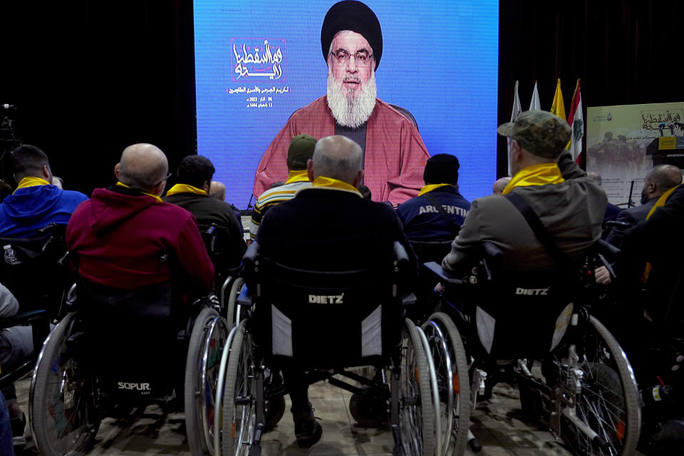 Wounded Hezbollah fighters listen to a speech by Hezbollah leader Sayyed Hassan Nasrallah via a video link, during a rally to mark the "Wounded Resistance Day," in the southern Beirut suburb of Dahiyeh, Lebanon, Monday, March 6, 2023. The leader of Lebanon’s militant Hezbollah group said Monday that they back former Cabinet minister and strong ally Sleiman Frangieh to become Lebanon’s next president. (AP Photo/Bilal Hussein)