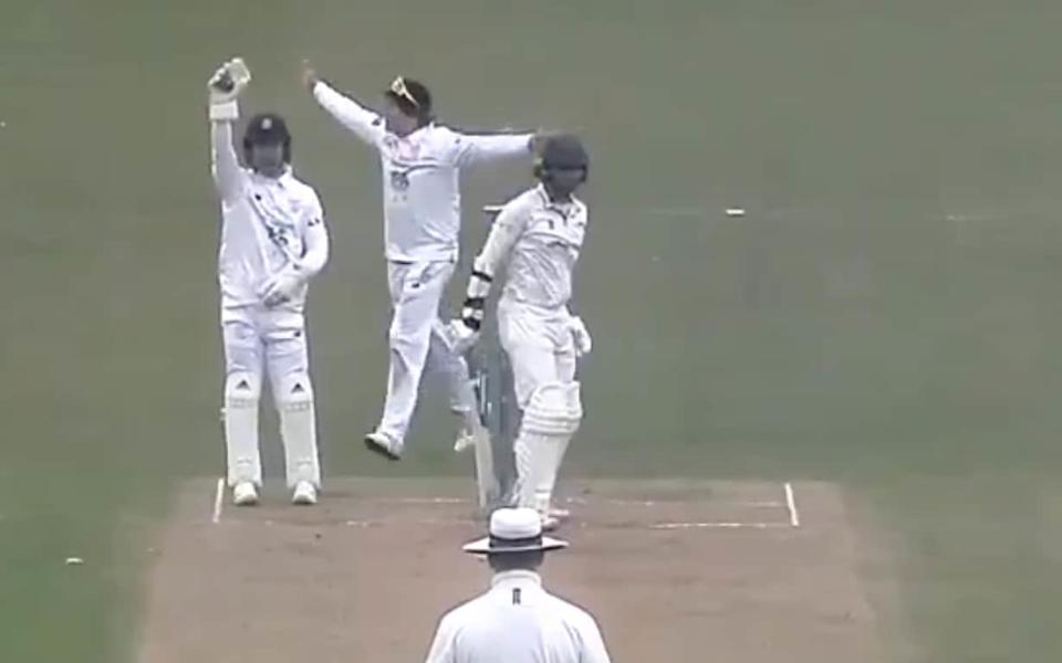 Having taken the bails off with his left hand McManus appeals for the stumping with his right, where the ball remains - Leicestershire Cricket Club