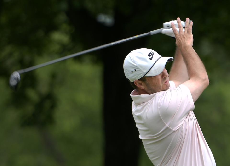 Dan Falcucci follows a tee shot at the Walter Cosgrove Four Ball tournament at Green Hill Municipal Golf Course on Sunday.