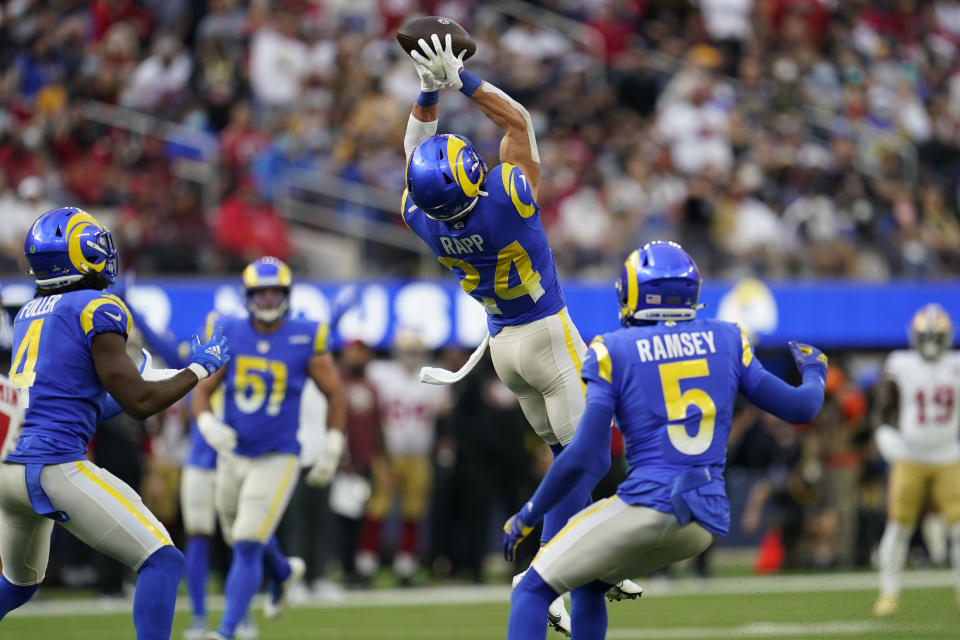 Los Angeles Rams free safety Taylor Rapp (24) intercepts the ball during the first half of an NFL football game against the San Francisco 49ers, Sunday, Jan. 9, 2022, in Inglewood, Calif. (AP Photo/Marcio Jose Sanchez)