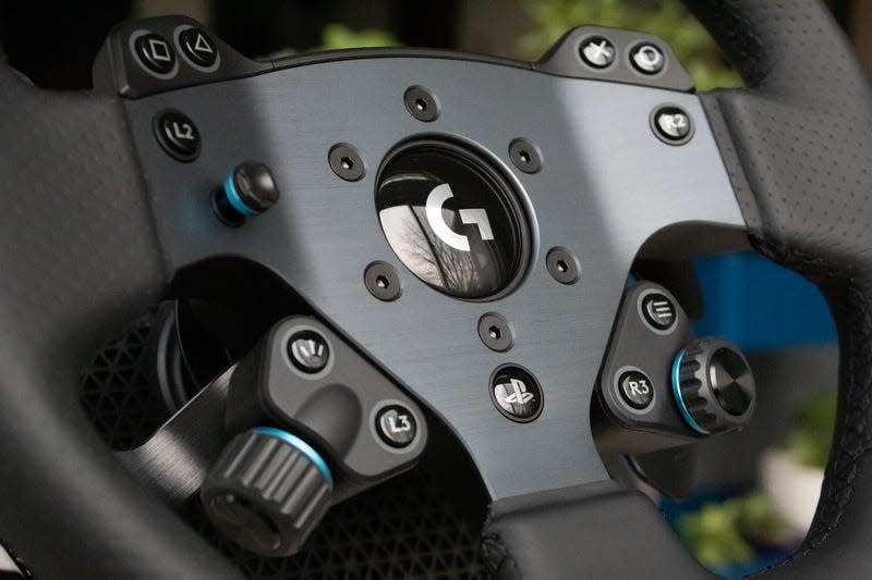 Close up on spokes and controls of Logitech G Pro steering wheel.