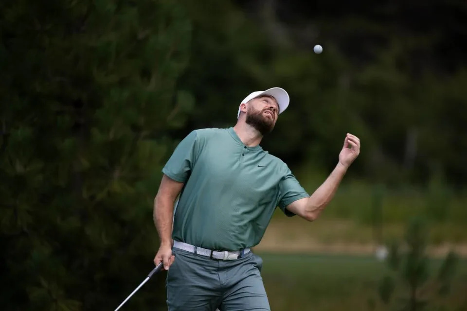 Kansas City Chiefs player Travis Kelce flips his ball after putting in on the 11th green in the first round of the American Century celebrity golf championship on Friday, July 12, 2024, in Stateline, Nev.