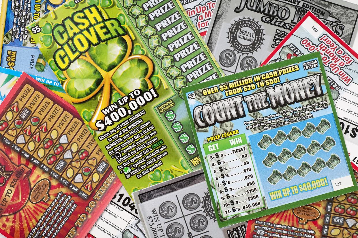 A pile of an assortment of $1, $2, and $5 Georgia lottery scratch-off tickets