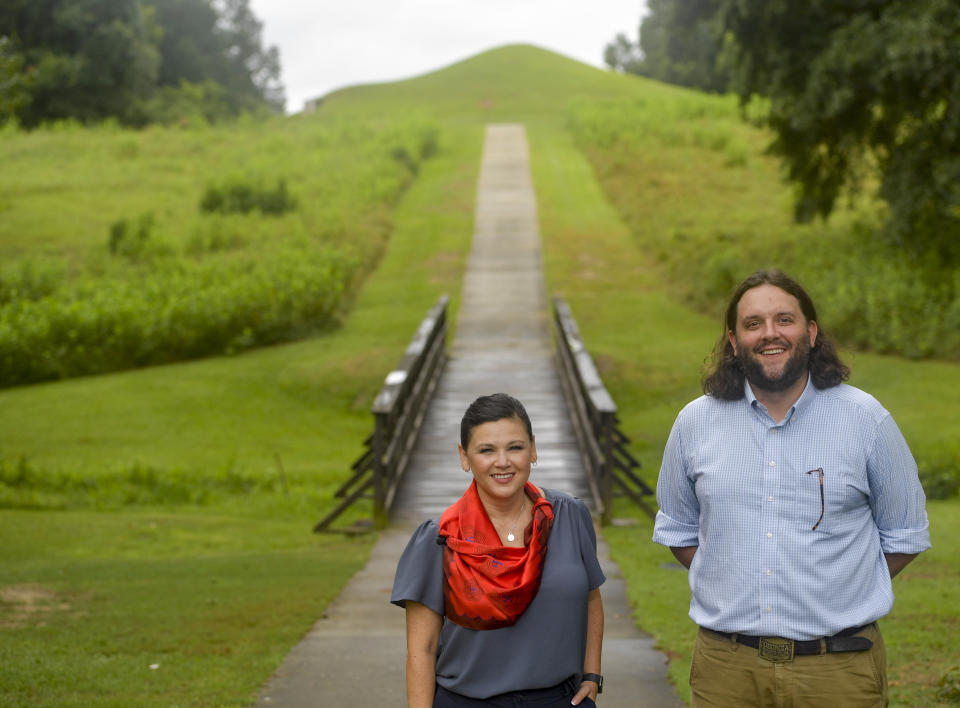 Tracie Revis, left, a citizen of the Muscogee Creek Nation, and Seth Clark, mayor pro-tem of Macon, stand at the approach to the Earth Lodge, where Native Americans held council meetings for 1,000 years until their forced removal in the 1820s, on Aug. 22, 2022, in Macon, Ga. Revis and Clark are co-directors of an initiative to bring 50 miles of the Ocmulgee River under federal protection as a national park. (AP Photo/Sharon Johnson)