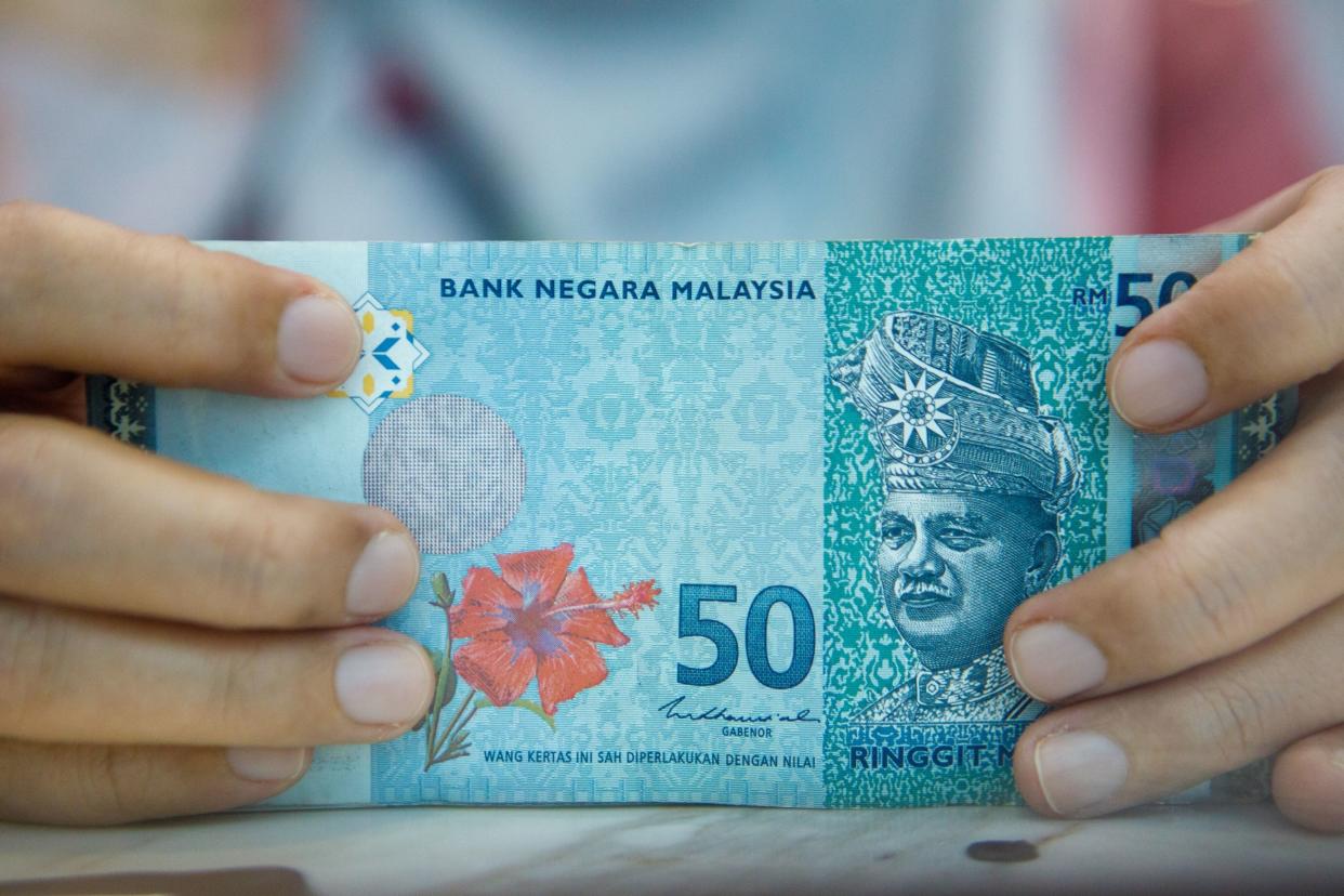 Malaysian fifty ringgit banknotes at a currency exchange store in Kuala Lumpur, Malaysia, on Tuesday, May 9, 2023. Photographer: Samsul Said/Bloomberg