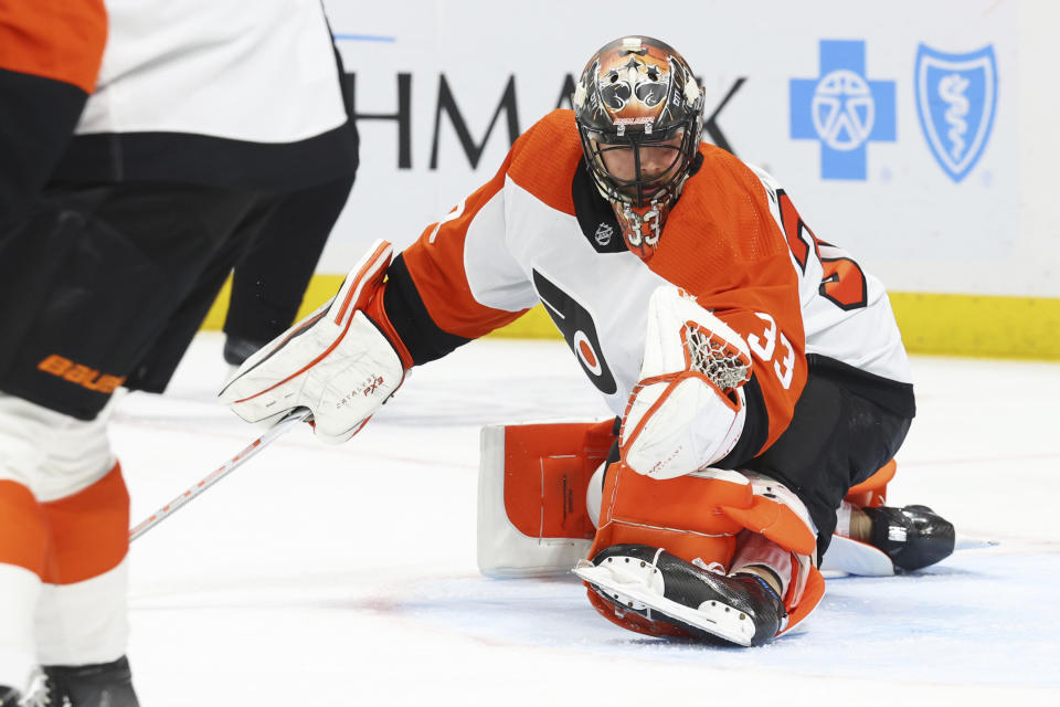 Philadelphia Flyers goaltender Samuel Ersson (33) makes a glove-save during the first period of an NHL hockey game against the Buffalo Sabres, Friday, Nov. 3, 2023, in Buffalo N.Y. (AP Photo/Jeffrey T. Barnes)