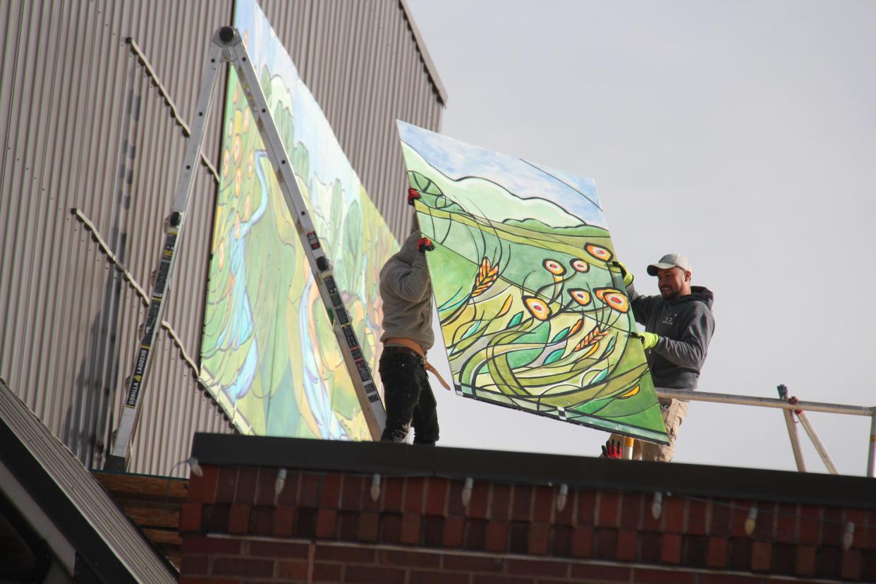 A new mural is installed above Raccoon Valley Bank on Tuesday, Nov. 7, 2023. A mural celebration will help kick off the Art on the Prairie weekend at 3 p.m. on Friday, Nov. 10 at Perry Perk.