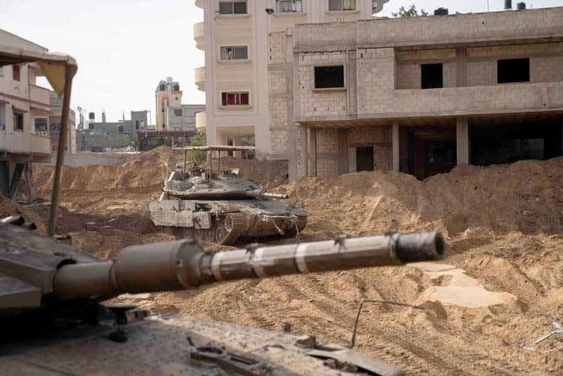 Israeli military vehicles operate in the Gaza Strip amid the ongoing conflict between Israel and the Palestinian Islamist group Hamas