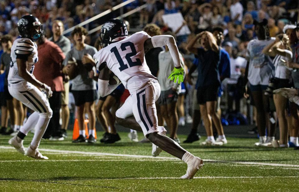 Jordan Bergeron #12 of Naples High School intercepts a Barron Collier pass during a a game against Barron Collier at Barron Collier on Friday, Sept. 29, 2023. Naples won 24-0.